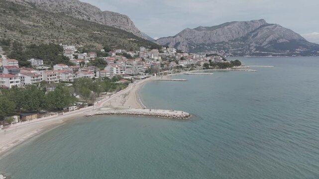 Aerial View of Mediterranean Coastal Town and Turquoise Bay