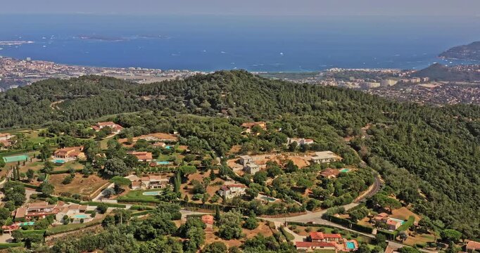 Tanneron France Aerial v26 drone flyover villages in les plaines, reveals beautiful mountain valley with pleasant mediterranean sea in the background - July 2021