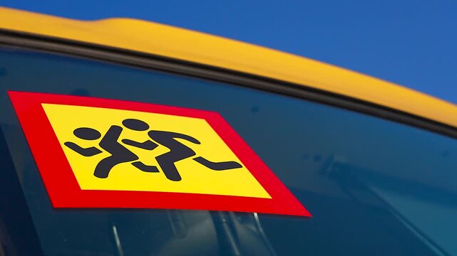 School bus warning sign on window.