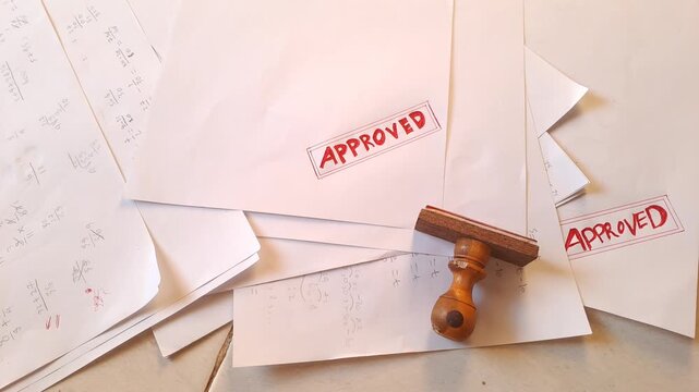 Red rubber stamp APPROVED on torn white paper with data background. Business document, contract, agreement. 4K video for paper background, white background, stamp, torn paper, data, business, office