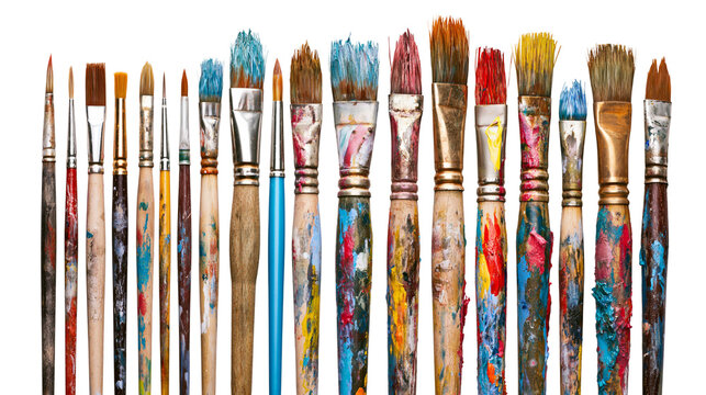 Assortment of used paint brushes with colorful paint splatters on handles