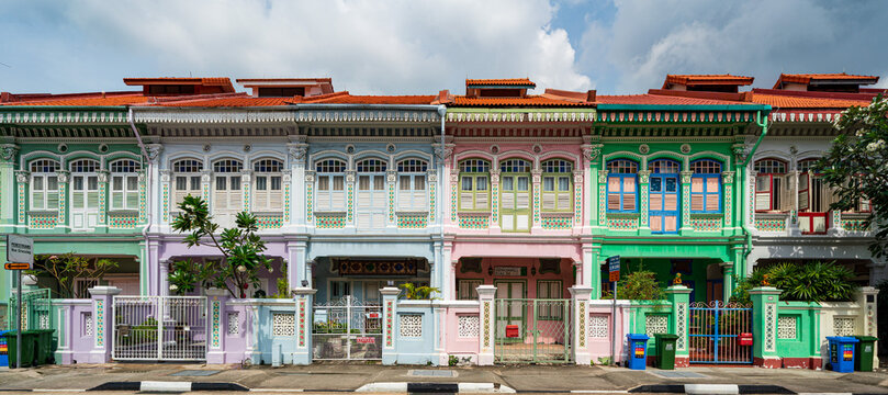 Front facade view of the iconic colorful pastel Peranakan shophouses on Koon Seng Road in Katong, Singapore