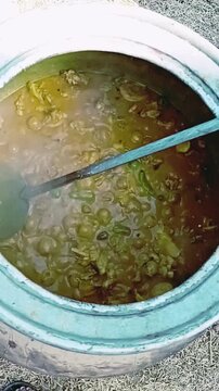Pakistani Style Meat Curry Stewing in Large Metal Pot