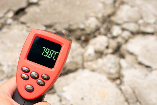 The sun-baked concrete pavement burns fiercely under blazing sunlight with an extreme sweltering temperature hitting 79.8 Celsius