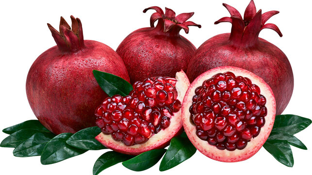Whole and halved pomegranates with arils and leaves