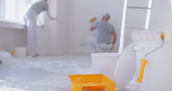 Home painting kit tray roll, house painter and decorator professional service team, male workers wearing uniform, wall surface repairs, painting, interior decor, repairing or replacing damaged drywall