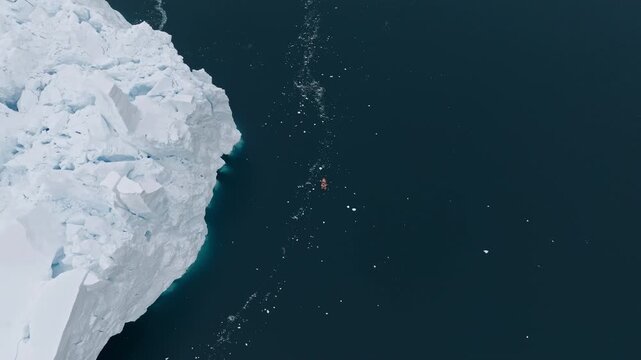 Aerial View Of Tourist Boat Beside Antarctic Ice Wall