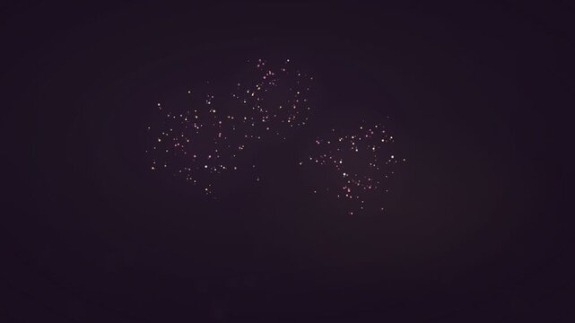 Subtle Pink and Yellow Particles Drifting on Dark Background