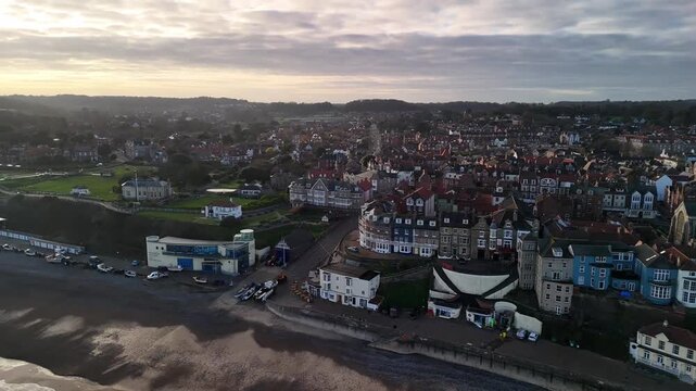 Golden Hour Aerial View of Cromer Town Church and Coastline in Norfolk England