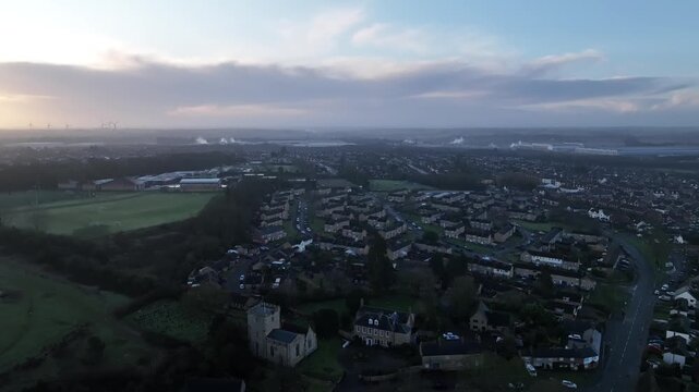 Aerial Drone View of Barton Seagrave Village at Dawn with Misty Northamptonshire Countryside