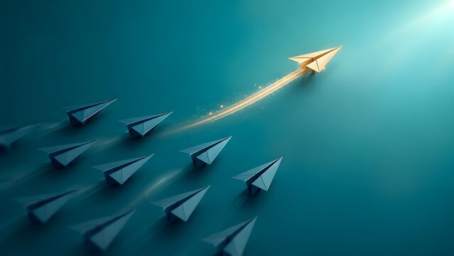 Distinctive gold paper airplane flying away from grey group on teal background representing creative innovation and individual business success.