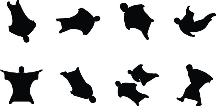 Set of black silhouettes of people in wingsuits skydiving and gliding for extreme sports and adventure design