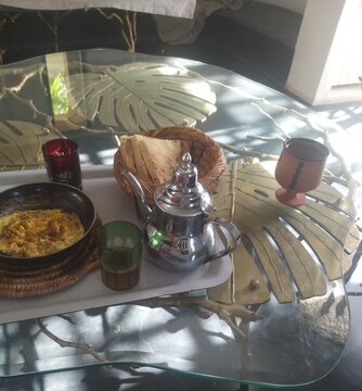 traditional moroccan breakfast with mint tea and bras on table 