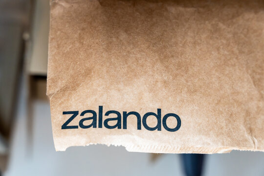 Warsaw, Poland - July 5, 2026: Close-up view of a Zalando branded paper bag reflecting the shopping experience in urban lifestyle and e-commerce trends.