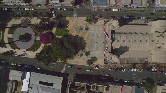 Aerial view of Tacna Cathedral surrounded by city streets and urban infrastructure in Tacna, Tacna, Peru.