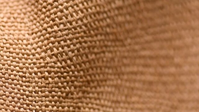 Wicker texture background, close up straw hat weave textile backdrop, top view, natural craft wallpaper. Closeup view of straw woven hand made texture background. Rotating 