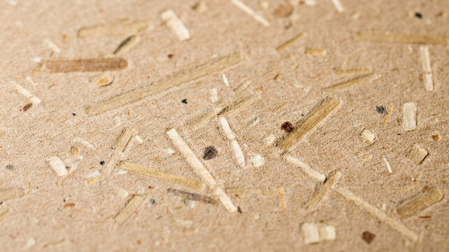 Wooden particleboard texture, brown wood chipboard background, wooden shavings, particle board surface