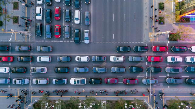 Urban Cityscape: Aerial View of Busy Traffic Junction and Congested Roads During Rush Hour Commute