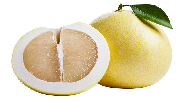 Whole and halved yellow pomelo citrus fruit with green leaf