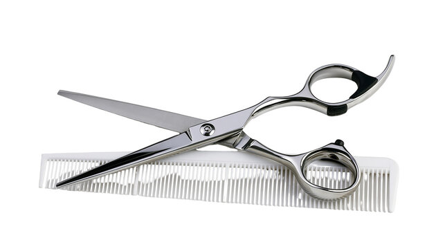 Professional steel barber scissors resting on a white comb