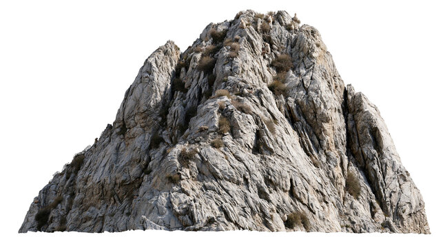 Jagged grey granite mountain peak with sparse dry vegetation