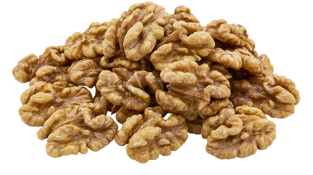 Pile of fresh walnut halves with textured brown shells