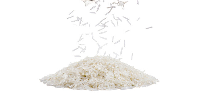 Pile of white uncooked long grain rice falling from above
