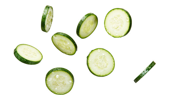 Fresh cucumber slices falling and scattered