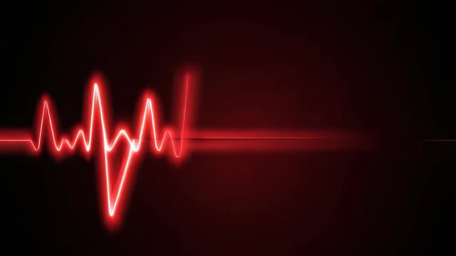 of a heartbeat being monitored on an electrocardiogram machine with red lines.