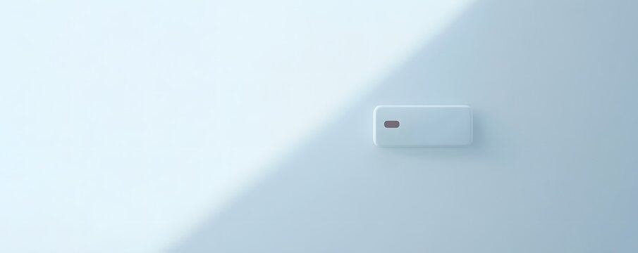 Minimalistic design featuring a sleek device on a pastel background.