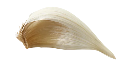 Single garlic clove with papery skin © Maelle