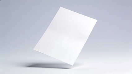 Naklejka premium Blank White Paper Sheet Floating in Studio