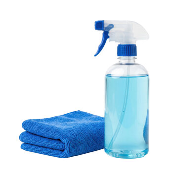 A clear spray bottle filled with bright blue cleaning liquid stands next to a folded blue microfiber cleaning cloth on a transparent background.