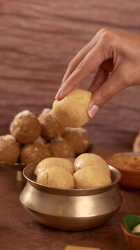 Jaggery Rasgulla Picked Up and Squeezed by Hand