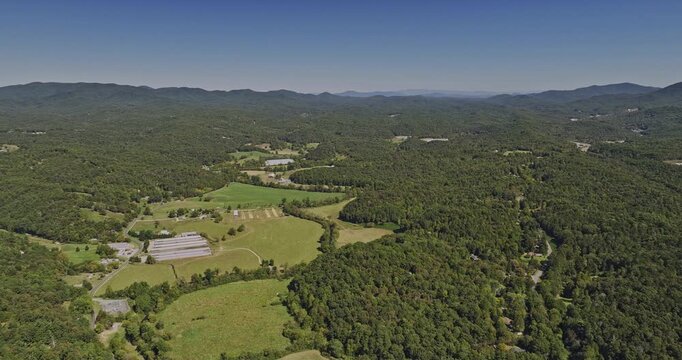 Ellijay Georgia Aerial v4 drone flyover mountain town surrounded by large tracts of natural forest and rolling hills, the wilderness landscape during the day - Shot with Mavic 3 Cine - October 2022