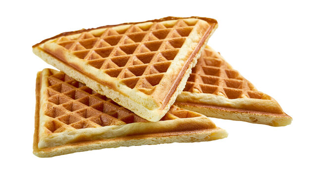 Stack of golden brown triangular waffles with grid pattern