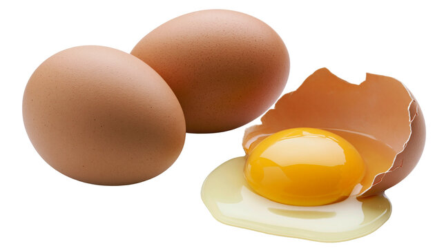 Whole brown eggs and cracked egg with bright yellow yolk