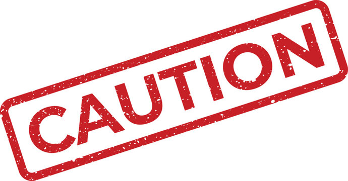 Red distressed rubber stamp with the word CAUTION prominently displayed, indicating a warning or alert