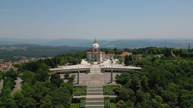 Aerial view of Sanctuary of Our Lady of Sameiro surrounded by lush green trees and hills in Braga, Braga, Portugal.