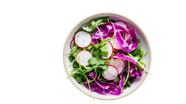 Fresh salad with arugula radish, and red cabbage in a bowl