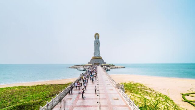 Timelapse of tourists moving around the Sea-based Guanyin statue in Sanya, Hainan Island, China.