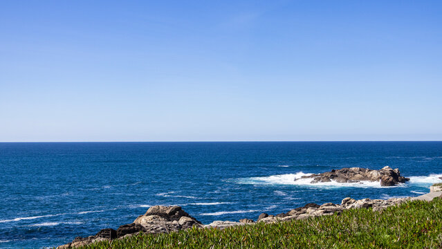 Rocky Atlantic ocean coast with waves and natural slope