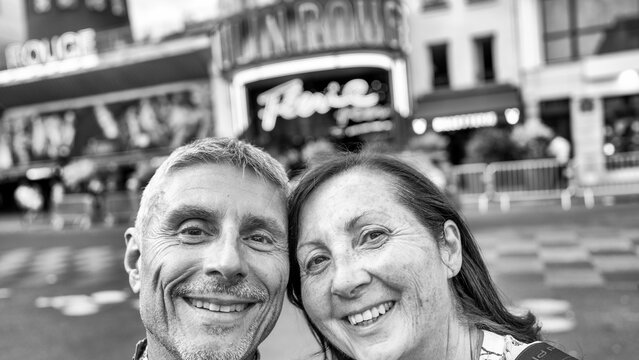 Couple sightseeing in Pigalle district near Montmartre.