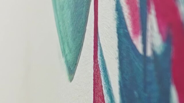 Close up on abstract artwork featuring bold teal, vibrant magenta, and hints of yellow. Lens glides smoothly across textured surface, revealing striking brushstrokes and dynamic painterly patterns.