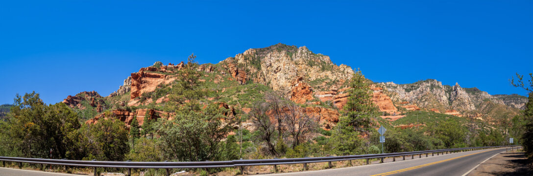 Striated red sandstone formation on Rte 89A leaving Sedona, Arizona, for Flagstaff Arizona, south of Oak Creek Canyon