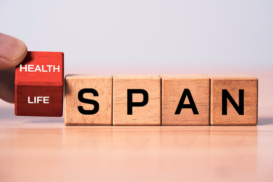 Wooden blocks flipping change between life span to health span symbolizing lifespan, healthy living, wellness longevity, preventive healthcare, quality of life and healthy aging concepts.