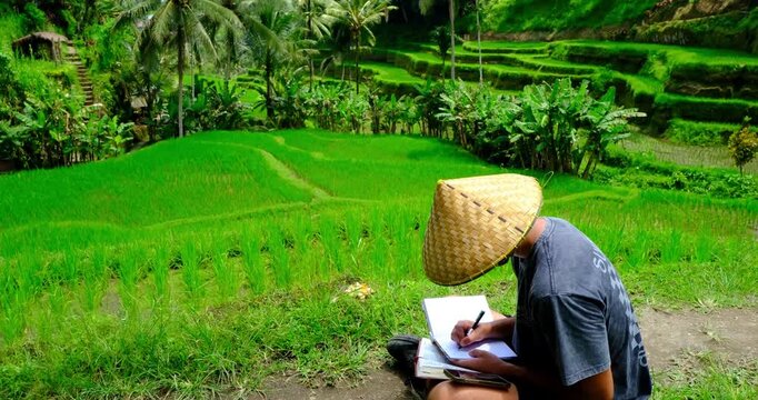 Time lapse of Man Reading Bible and Writing Journal in Bali Rice Fields, Indonesia | Peaceful Christian Devotional in Nature