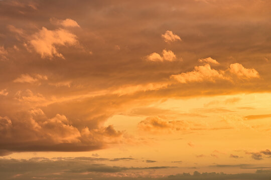 Golden clouds at Zandvoort during sunset, with soft warm tones and textured sky gradients ideal for calm atmospheric designs.