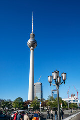 Berlin, Germany - April 22, 2026: Berlin TV Tower (Fernsehturm) rising above Alexanderplatz under a clear blue sky in the city center © Andrei Antipov