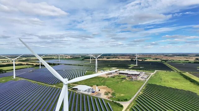 Aerial view of wind turbines and solar panel arrays at Chelveston Renewable Energy in Chelveston, England, United Kingdom.